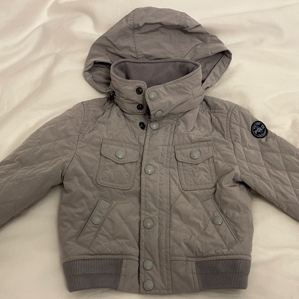 Ralph Lauren Light Weight stylish jacket with pocket for hood in collar.